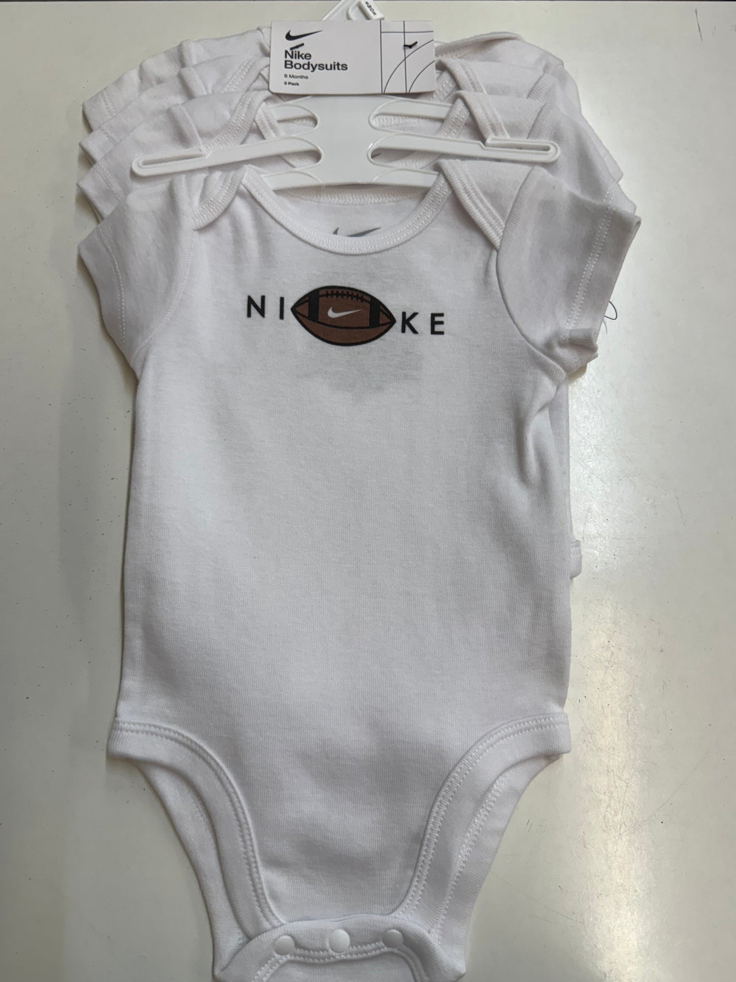 New 4pc Nike Bodysuits, 6m